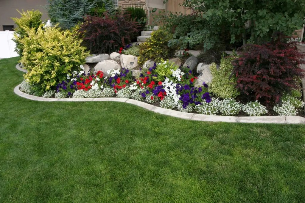 garden bed with red, white, blue flowers